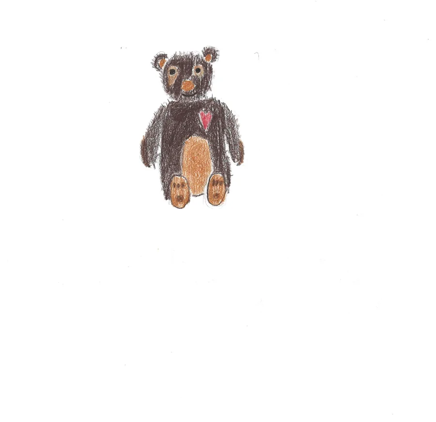 A small brown teddy bear